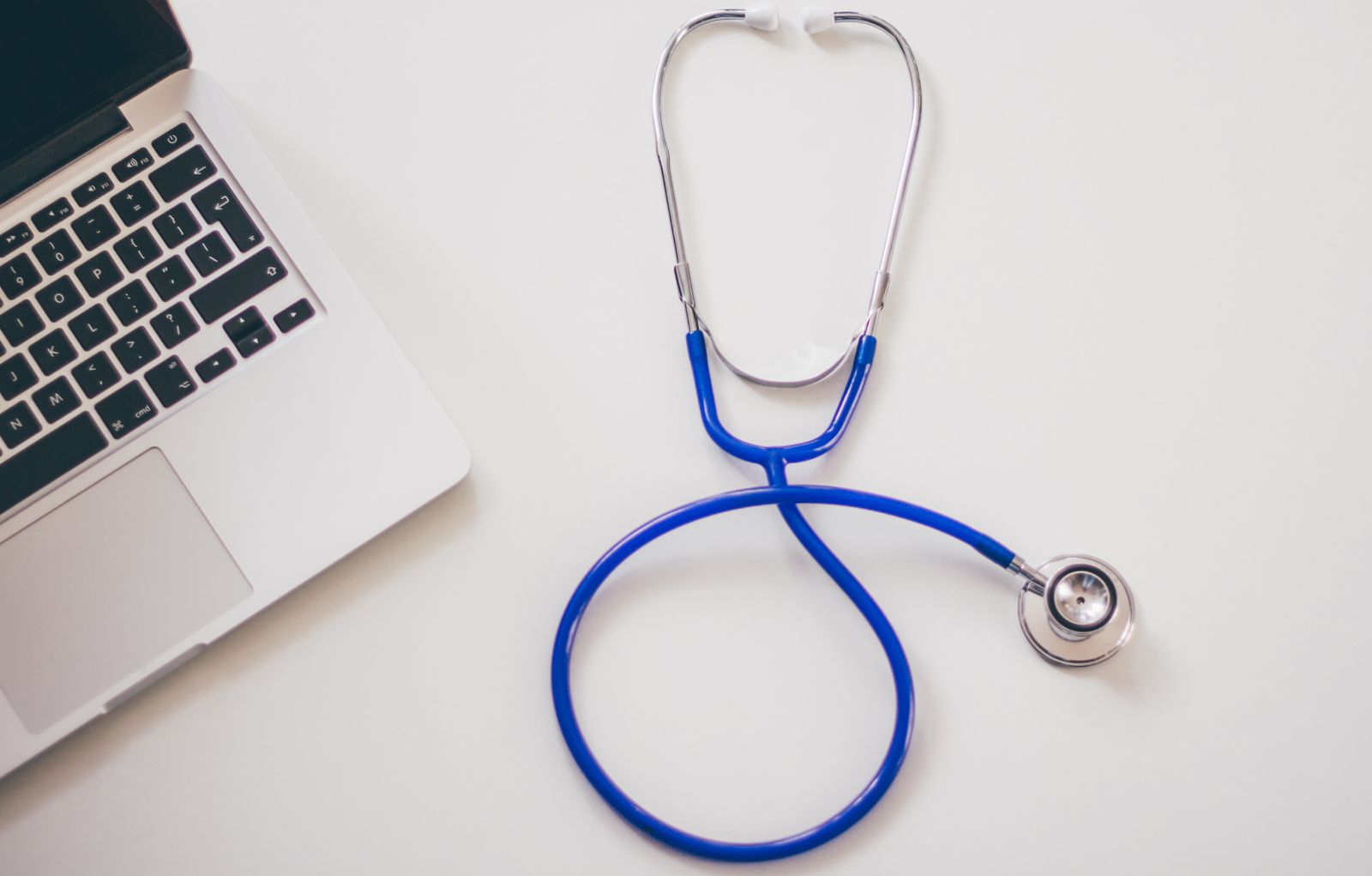 Laptop and stethoscope for an online medical consultation